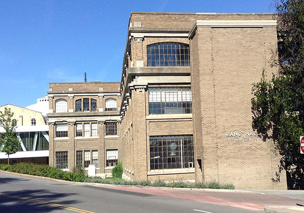 Figure 7a. The formal division of Rand Hall's facades into a two-story "base" and a one-story "top" contradicts the position of a double-volume space on the top two floors. (Photo by J. Ochshorn, August, 2015)